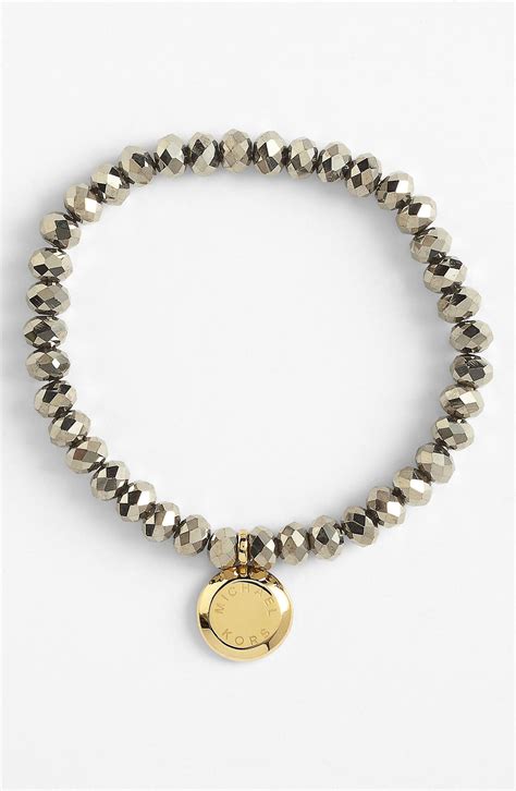 michael kors gold armband brillance|Michael Kors charm bracelet.